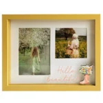 Yellow photo frame with two sections displaying scenic photographs and the text 'Hello Beautiful' written in cursive with a floral boot decoration.